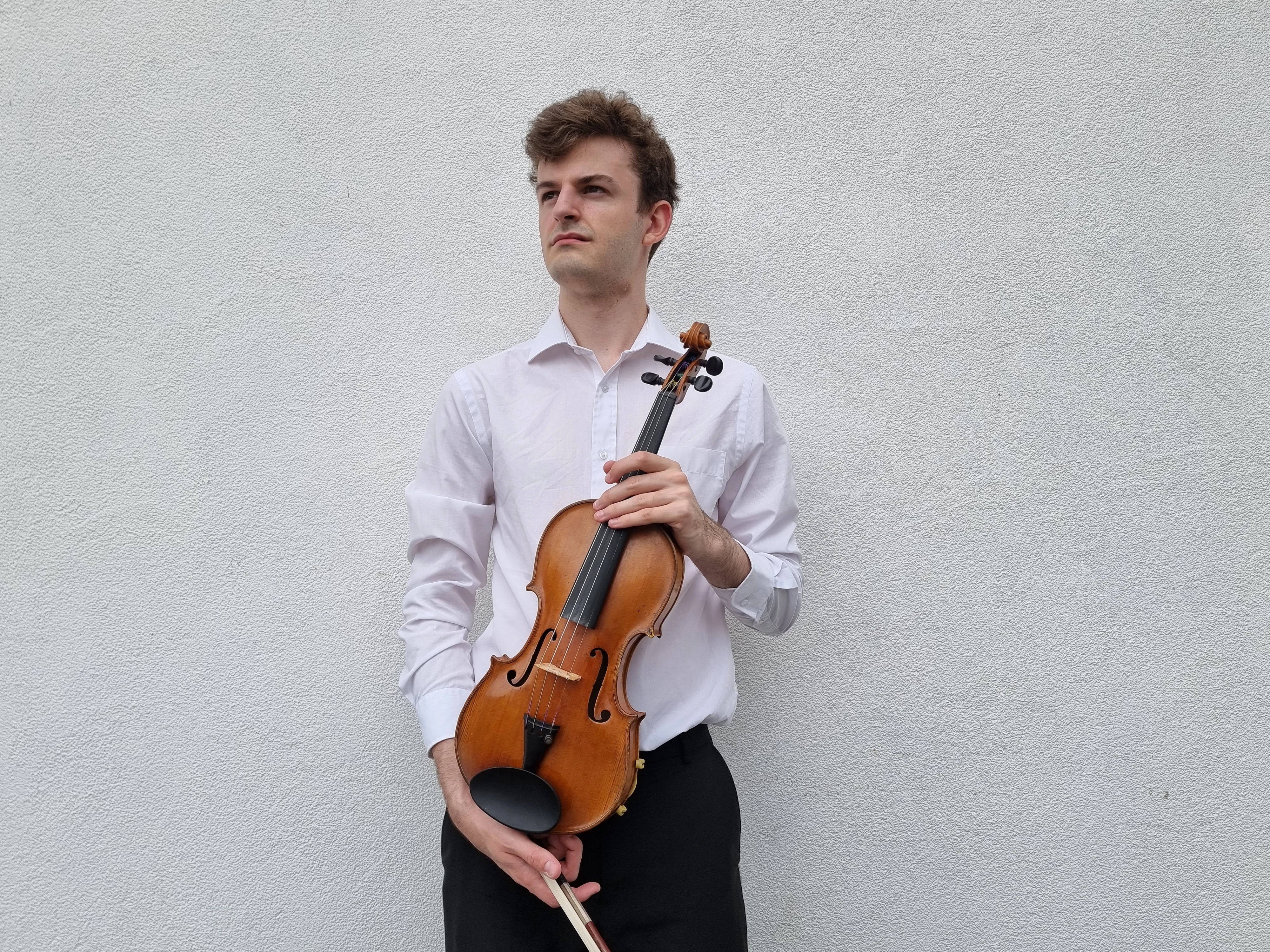 James with violin on white background